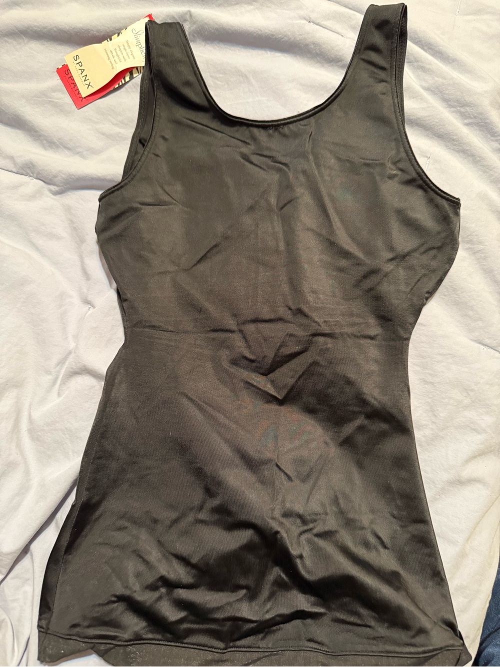SPANX Red Accent Label on Black Fabric